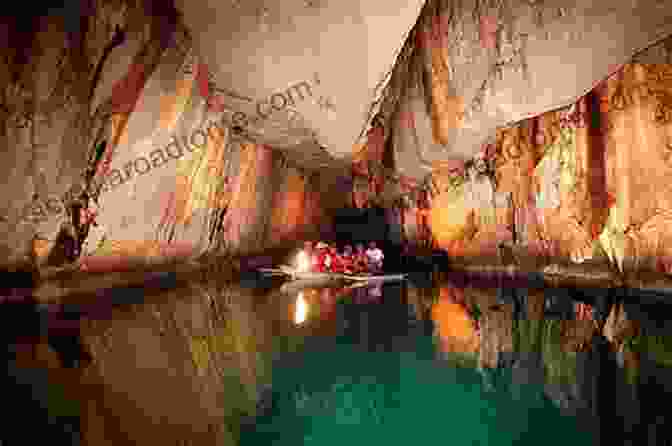 A Boat Navigating The Palawan Mysterious Underground River, Surrounded By Towering Limestone Formations And Shimmering Waters PALAWAN S MYSTERIOUS UNDERGROUND RIVER James Brady