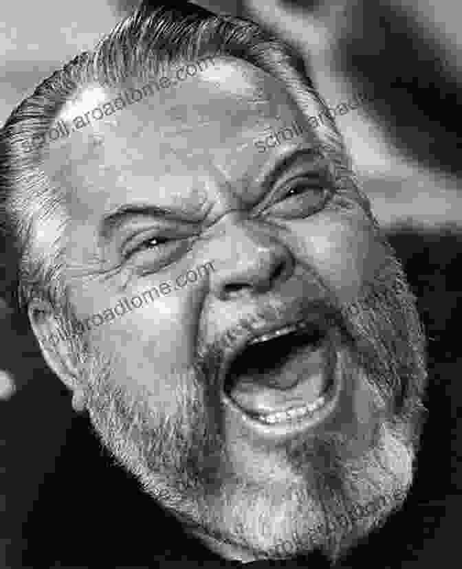 A Vintage Black And White Portrait Of Orson Welles, His Piercing Gaze And Enigmatic Smile Drawing The Viewer In. The Magic World Of Orson Welles