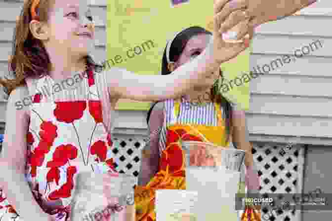 Ava Mae And Sophia Enthusiastically Selling Lemonade To A Group Of Smiling Children. Ava Mae Own A Lemonade Stand